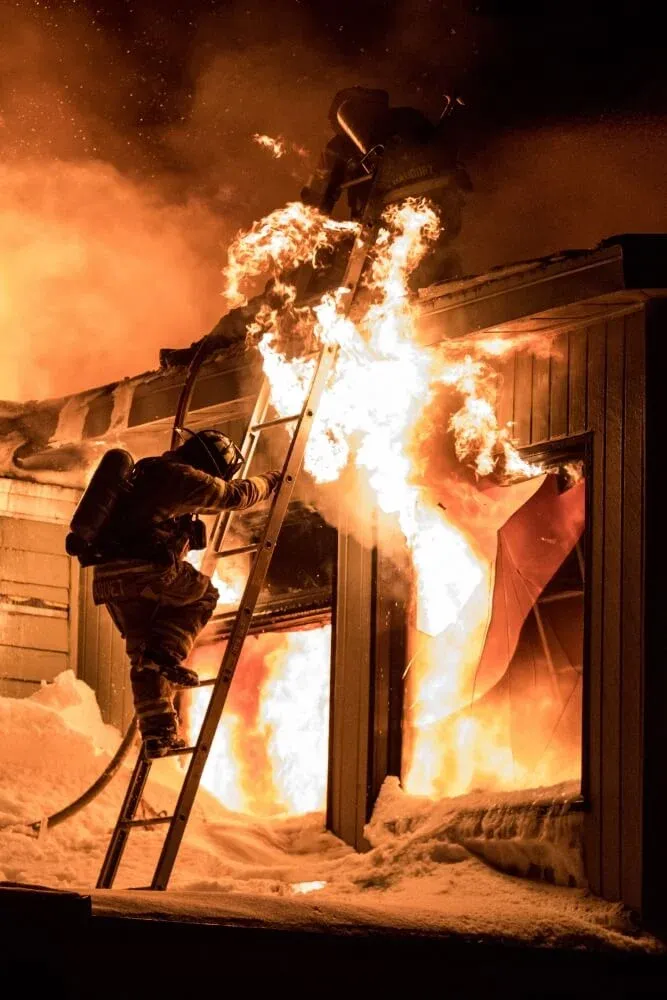 Firefighter battling flames